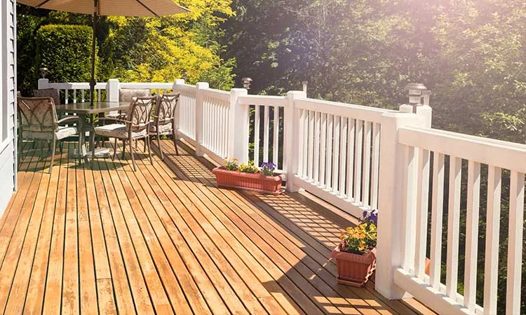 A finished cedar deck with railings
